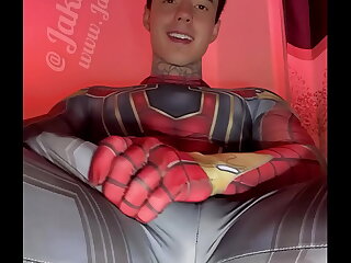 Jakipz, a superhero-themed adult content creator, flaunts his massive cock in various costumes, teasing and stroking it to a pulsating climax. His dirty talk and muscular physique add to the erotic allure.