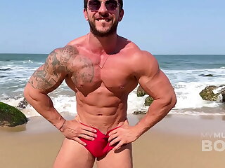 Muscle-hungry James Santos dominates a nudist beach, flexing his sculpted physique. Witness his muscular prowess as he poses, flexes, and earns passionate worship, culminating in a climactic release.